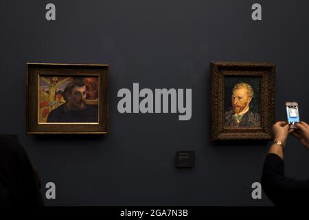 Paul Gaugin and Vincent Van Gogh self portrait at the Orsay Museum, in Paris Stock Photo