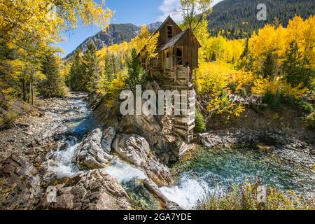 The Crystal Mill in Colorado from the best vantage point. I meticulously planed this photo to ensure the aspens were at their peak yellow in autumn. Stock Photo