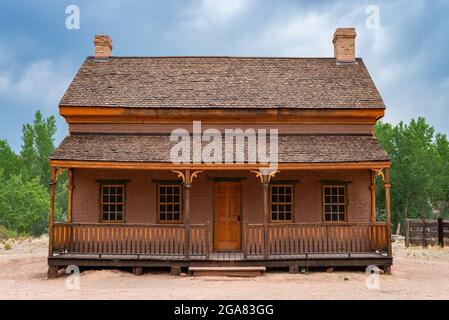Old wooden building in abandoned town on a cloudy Summer morning. Stock Photo