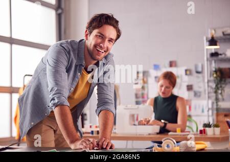 Portrait Of Male And Female Students Or Business Owners Working In Fashion Studio Together Stock Photo