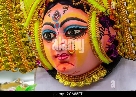 Colorful chhou masks of Hindu Goddess Durga, on display for sale at handicrafts fair, Kolkata, West Bengal, India. Stock Photo