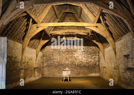 A genuine excellent example of the interior of a tithe barn in the village of Lacock, Wiltshire, England, UK Stock Photo