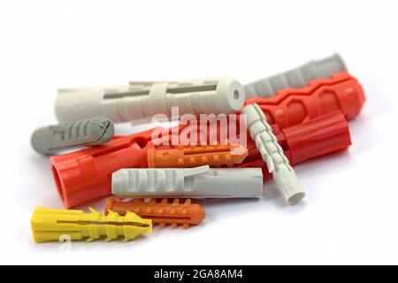 Plastic dowel in front of white background Stock Photo