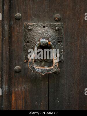 Close-up image of a knocker on a shabby door Stock Photo