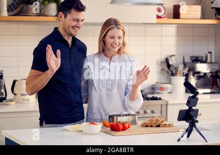 Couple Vlogging Making Social Media Video About Cooking For The Internet Stock Photo