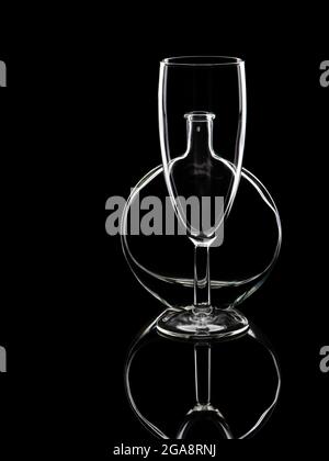 Glass and bottle, glassware still life in monochrome. Stock Photo