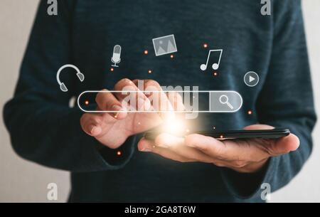 Close up hands holding smartphone. man working with smart phone and with blank search bar. Searching Browsing Internet Data Information Networking Con Stock Photo