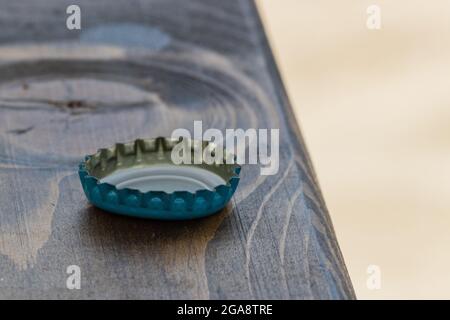 Metal beer cap on the table from beer Stock Photo