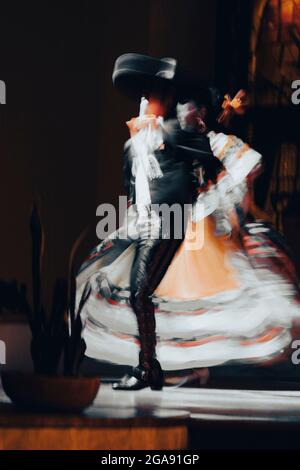 mexican dancers performing mexican folk dance. Latin Dance Stock Photo