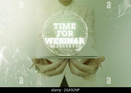 Text sign showing Time For Webinar. Business idea elearning, web conference, webcasting, realtime online collaboration Woman In Suit Holding Tablet Stock Photo
