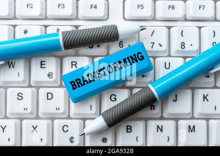 Handwriting text Brainstorming. Concept meaning group discussion leading to ideas or solutions problems Typing Certification Document Concept Stock Photo