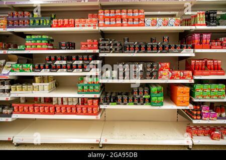 Taplow, Buckinghamshire, UK. 29th July, 2021. Some customers have been panic buying tinned tomatoes eaving some gaps in the shelves, however, Sainsbury's Supermarket in Taplow was well stocked this morning. There are some supply chain issues in general with supermarkets due to HGV lorry driver shortages as well as supply chain production staff having to self isolate due to having been pinged by the Covid-19 NHS Track and Trace app19 Stock Photo