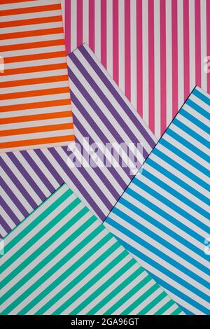 Abstract, geometric background. Top view of a geometric background of striped multicolored paper sheets Stock Photo
