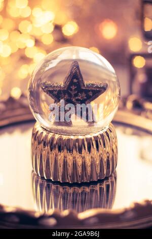 Holiday star in glass ball, Christmas decorations Stock Photo