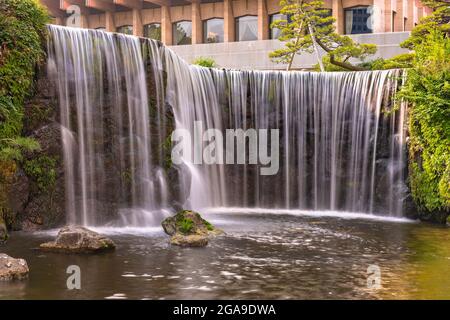 tokyo, japan - july 25 2021: Closeup long exposure on the big waterfall of the Hotel New Otani famous for its Japanese Garden in the kioi district. Stock Photo