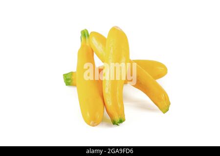 Freshly picked fresh baby yellow zucchini on a white background. Stock Photo