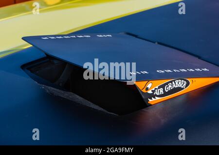 PLYMOUTH, MI/USA - JULY 26, 2021: Close-up of a 1971 Plymouth GTX Air Grabber hood scoop at Concours d'Elegance of America at The Inn at St. John’s. Stock Photo