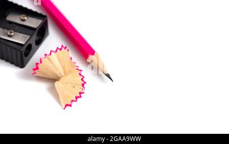 A Freshly Sharpened Pencil and Sharpener Isoalted on a White Background Stock Photo