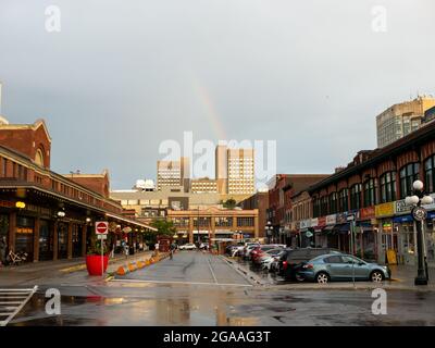 Ottawa, Ontario, Canada. July 2021. People stand out in the streets of Byward Market after a heavy rain. Byward is a very popular tourist district. Stock Photo