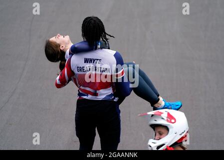 Great Britain's Silver medalist Kye Whyte helps carry Bethany Shriever after she wins Gold in the Cycling BMX Racing at the Ariake Urban Sports Park on the seventh day of the Tokyo 2020 Olympic Games in Japan. Picture date: Friday July 30, 2021. Stock Photo