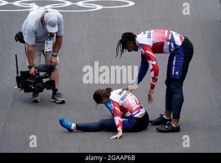 Great Britain's Silver medalist Kye Whyte helps Bethany Shriever after she wins Gold in the Cycling BMX Racing at the Ariake Urban Sports Park on the seventh day of the Tokyo 2020 Olympic Games in Japan. Picture date: Friday July 30, 2021. Stock Photo