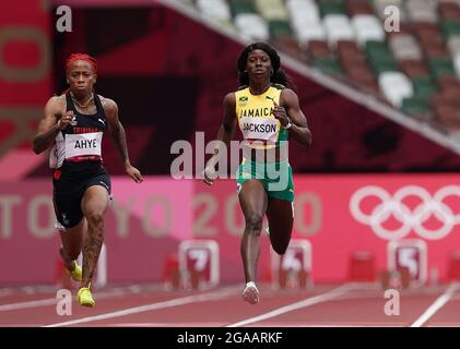 Tokyo, Japan. 30th July, 2021. Shericka Jackson (R) of Jamaica competes during the Women's 100m Heat at the Tokyo 2020 Olympic Games in Tokyo, Japan, July 30, 2021. Credit: Li Gang/Xinhua/Alamy Live News Stock Photo