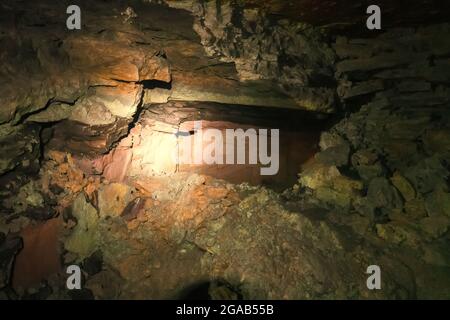 artificial cave under earth journey. wild cave, forgotten passages deep underground Stock Photo