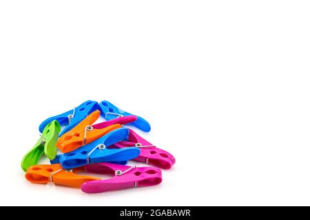 colorful plastic clothes pegs on white background Stock Photo