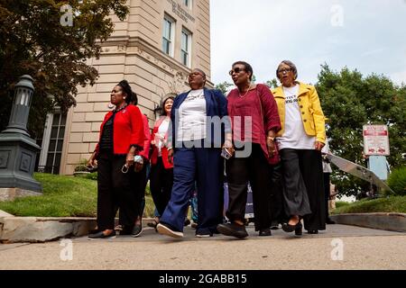 Washington, DC, USA. 29th July, 2021. Pictured: Black Women lead a short march to the Hart Senate Building for a civil disobedience action at a voting rights speak-out event hosted by the National Coalition on Black Civic Participation. Left to right: Congresswoman Sheila Jackson Lee (D-TX), Rev. Hyepin Im (second row), Melanie Campbell, Cora Masters Barry, and Dr. Johnnetta Cole. Credit: Allison Bailey/Alamy Live News Stock Photo