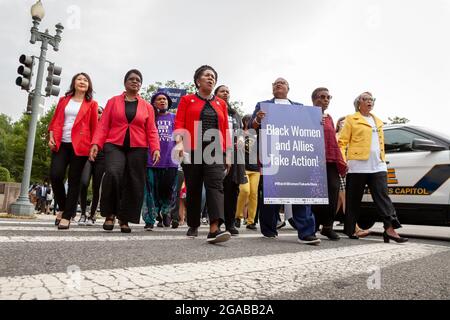 Washington, DC, USA. 29th July, 2021. Pictured: Black Women lead a short march to the Hart Senate Building for a civil disobedience action at a voting rights speak-out event hosted by the National Coalition on Black Civic Participation. Left to right: Rev. Hyepin Im, Rev. Dr. Barbara Williams-Skinner, Faya Toure, Congresswoman Sheila Jackson Lee (D-TX), Rev. Leslie Copeland-Tune, Melanie Campbell, Cora Masters Barry, and Dr. Johnnetta Cole. Credit: Allison Bailey/Alamy Live News Stock Photo