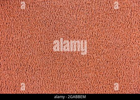 Red vinyl dust trap carpet texture background Stock Photo