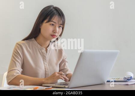 Young Asian freelancer work from home in the pandemic Stock Photo