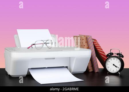 Compact home laser printer against pink background Stock Photo