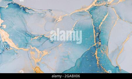 Abstract liquid ink painting background in pastel colors with gold splashes Stock Photo