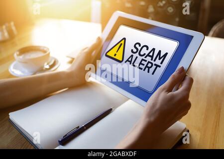 Scam alert detecting warning. Notification on device screen. Stock Photo