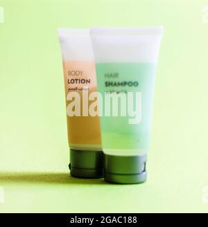 Close up shot of shampoo and body lotion tubes with English and Arabic text o them. Stock Photo