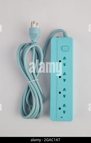 Empty light blue electric plug, four sockets with long cable isolated on white background Stock Photo