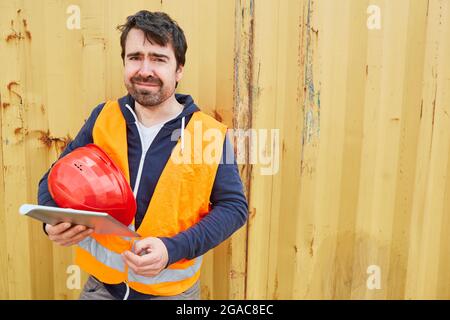 Construction worker or craftsman using tablet computer when planning a construction project Stock Photo