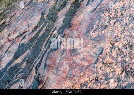Natural stone background. Sea stone texture. Panel texture. Spots gray red background. Background fill. Stock Photo
