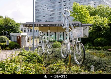 Flensburg, Germany. 28th July, 2021. Bicycle sculptures stand in front of the Federal Motor Transport Authority (KBA). The law establishing the KBA was promulgated on 4 August 1951. Since 5 May 1952, the authority has had its headquarters in Flensburg. Credit: Frank Molter/dpa/Alamy Live News Stock Photo