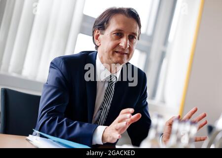 Flensburg, Germany. 28th July, 2021. Richard Damm, President of the Federal Motor Transport Authority (KBA), speaks during an interview. The law establishing the KBA was promulgated on 4 August 1951. Since 5 May 1952, the authority has had its official headquarters in Flensburg. Credit: Frank Molter/dpa/Alamy Live News Stock Photo