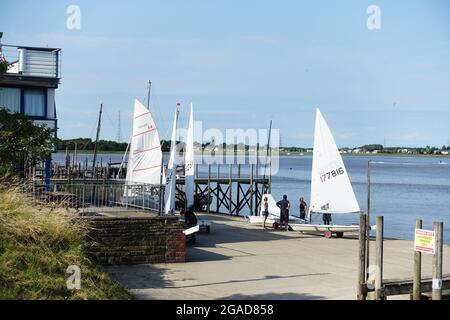 Sailing dinghies preparing for a race at the Blackwood and Fleetwood Yacht Club on the River Wyre Stock Photo