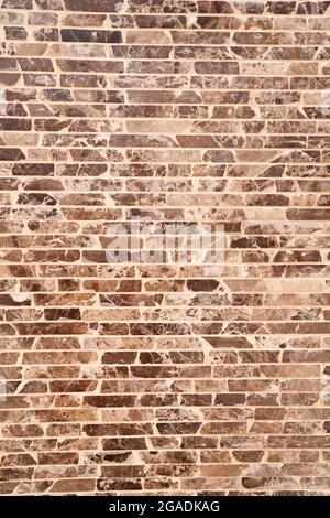 Designer brown and black brick wall. Close-up Stock Photo