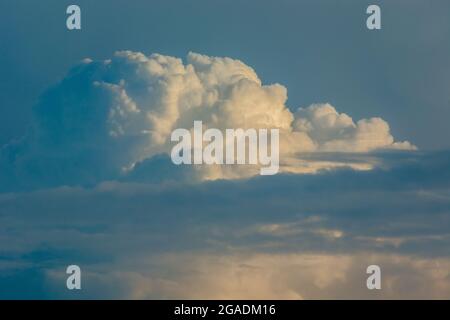 Cumulus clouds against the blue sky, spring day Stock Photo
