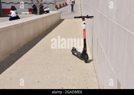 Marseille, France. 10th July, 2021. An electric scooter abandoned on a pedestrian footbridge in Marseille. (Credit Image: © Gerard Bottino/SOPA Images via ZUMA Press Wire) Stock Photo