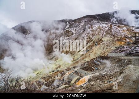 Active volcano in Owakudani Valley, hot thermal steam geysers and volcanic rock. Located in Fuji Hakone Izu National Park, Japan. Stock Photo