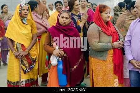 2019: A group of Hindu devotees in colorful traditional clothes with various facial expressions in Vrindavan, Uttar Pradesh, India. Stock Photo