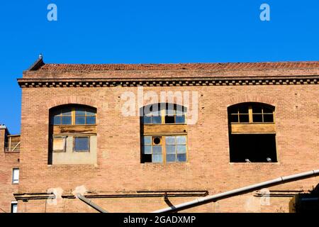 Textile mill, 19th century, windows, red bricks. Stock Photo