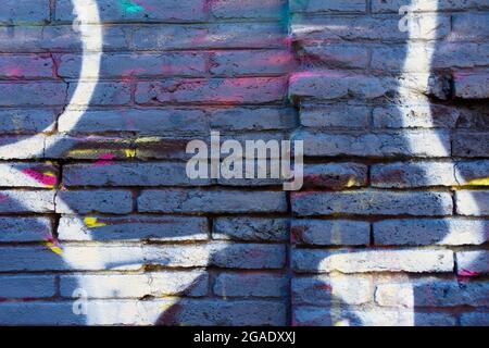 Blue brick wall with white lines painted on. Stock Photo