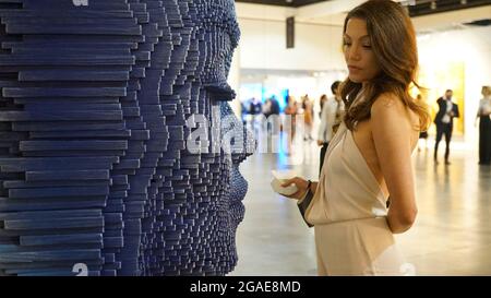 Los Angeles, USA. 29th July, 2021. A woman visits the LA Art Show in Los Angeles, the United States, July 29, 2021. More than 80 exhibiting galleries and museums from North and South America, Asia and Europe took part in the four-day event this year. Credit: Zeng Hui/Xinhua/Alamy Live News Stock Photo